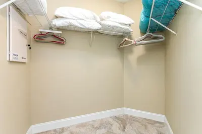 a walk in closet with shoes and towels at Beach Vibes & 30th Floor Ocean Views in Sunny Isles Beach