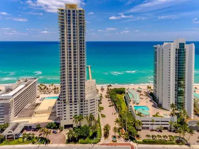 a view of the beach and buildings and the ocean at Beach Vibes & 30th Floor Ocean Views in Sunny Isles Beach