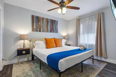 a bedroom with a bed and a ceiling fan at Luxurious Hollywood Retreat Perfect Getaway in Hollywood