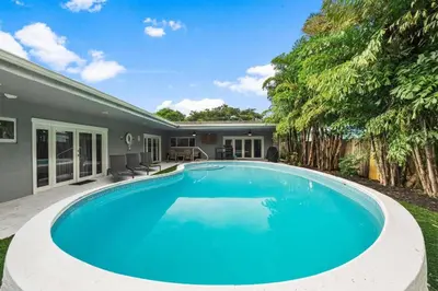 a swimming pool in the backyard of a house at Luxurious Hollywood Retreat Perfect Getaway in Hollywood
