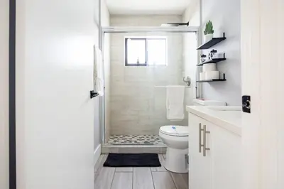 a white bathroom with a toilet and a shower at Private Double Room Near Miami Clinics in Miami