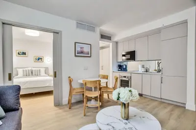 a kitchen and living room with a table and a bed at Vonder Miami Beach - Unit 2 in Miami Beach