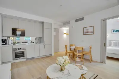 a kitchen and living room with a table and chairs at Vonder Miami Beach - Unit 3 in Miami Beach