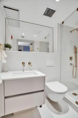 a white bathroom with a sink and a toilet at Vonder Miami Beach - Unit 3 in Miami Beach