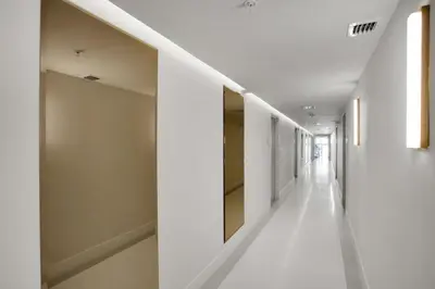 a hallway of a building with white walls and white floors at Vonder Miami Beach - Unit 4 in Miami Beach
