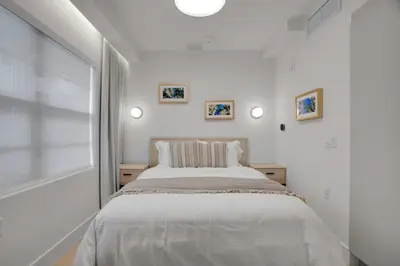 a white bedroom with a large bed in it at Vonder Miami Beach - Unit 8 in Miami Beach