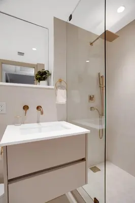 a white bathroom with a sink and a shower at Vonder Miami Beach - Unit 7 in Miami Beach