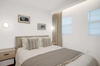 a white bedroom with a bed and a window at Vonder Miami Beach - Unit 9 in Miami Beach