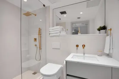 a bathroom with a toilet and a sink and a shower at Vonder Miami Beach - Unit 10 in Miami Beach