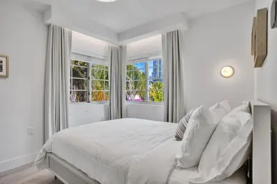 a white bedroom with a bed and a window at Vonder Miami Beach - Unit 11 in Miami Beach