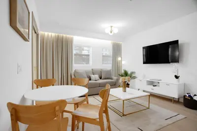 a living room with a table and a couch at Vonder Miami Beach - Unit 13 in Miami Beach