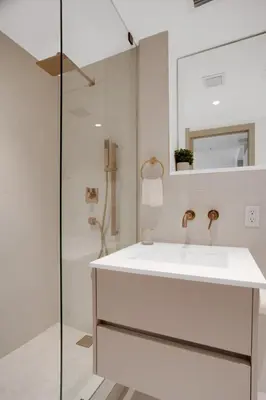 a white bathroom with a sink and a shower at Vonder Miami Beach - Unit 14 in Miami Beach