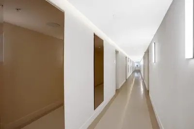 a hallway of a hospital with white walls and white floors at Vonder Miami Beach - Unit 15 in Miami Beach