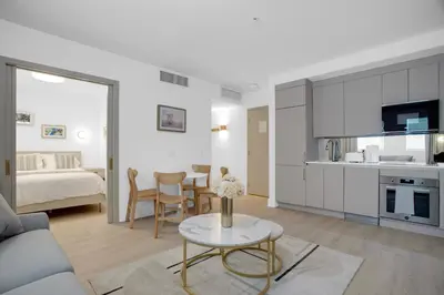 a kitchen and living room with a couch and a table at Vonder Miami Beach - Unit 18 in Miami Beach
