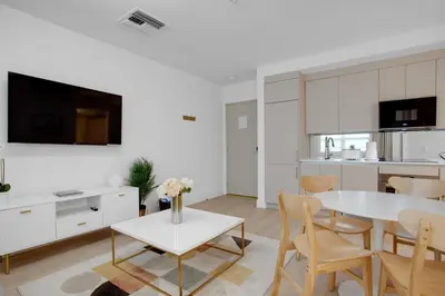 a kitchen and living room with a table and chairs at Vonder Miami Beach - Unit 17 in Miami Beach