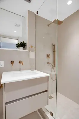 a white bathroom with a sink and a shower at Vonder Miami Beach - Unit 19 in Miami Beach