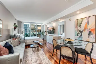 a living room with a couch and a table at Renovated Coconut Grove Studio includes Parking in Miami