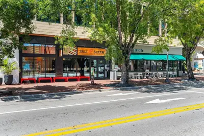 an empty street in front of a store at Renovated Coconut Grove Studio includes Parking in Miami