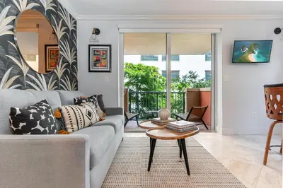 a living room with a couch and a table at The Palms Coconut Grove 1 bedroom condo includes parking in Miami