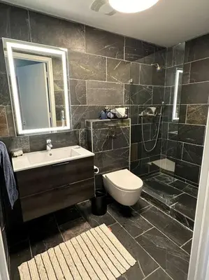 a bathroom with a sink and a toilet and a shower at North Bay Village - perfect view in Miami Beach
