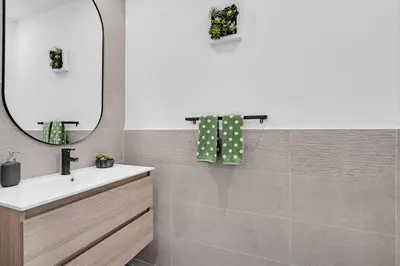 a bathroom with a sink and a mirror at Paraiso House Pool 10 Ppl 6 mins Coconut Grove in Miami