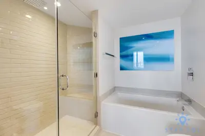a bathroom with a shower and a bath tub at High Floor 3BR - 2BA - Resort Fees & Parking Incl in Hollywood