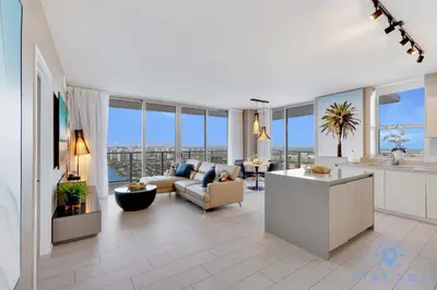 a living room with a couch and a table at High Floor 3BR - 2BA - Resort Fees & Parking Incl in Hollywood