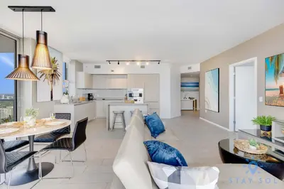 a living room and kitchen with a couch and a table at High Floor 3BR - 2BA - Resort Fees & Parking Incl in Hollywood