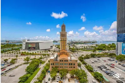 a view of a city with a clock tower at Modern 1BD & Den With City Views in Miami