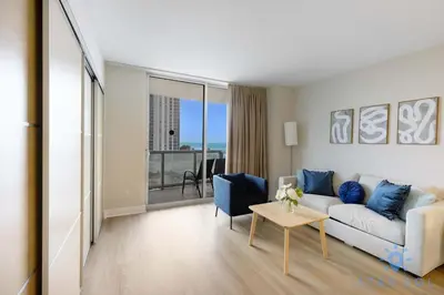 a living room with a couch and a table at Amazing Apartment Oceanview Beautiful Amenities in Sunny Isles Beach