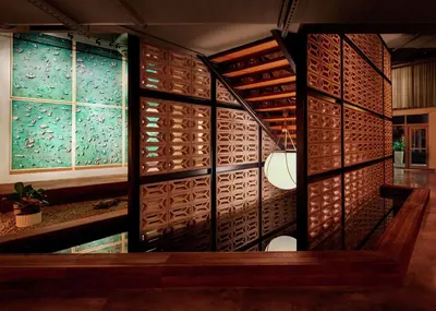 a wine cellar with wooden walls and windows at The Gates Hotel South Beach in Miami Beach
