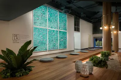 a room with a large window and a wooden floor at The Gates Hotel South Beach in Miami Beach