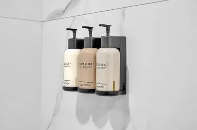 a group of four bottles of soap on a shelf at 2bedroom City Ocean Treasure in Miami