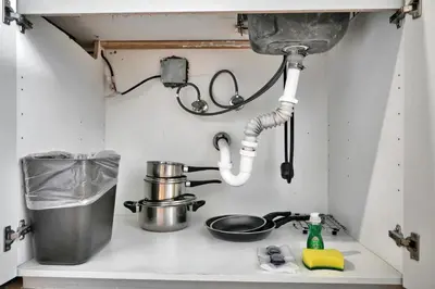 a kitchen counter with a sink with a pot on it at Find Tranquility in the Grove in Miami