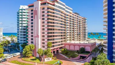an image of a large apartment building with the ocean in the background at Beautiful 2 Br Apartment Amazing Pool in Miami Beach