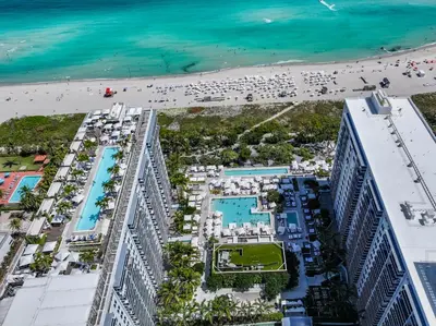 an aerial view of a hotel and the beach at Romantic-5 star-1BR-Oceanfront-Balcony-South-Beach in Miami Beach