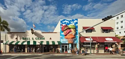 a city street with a building with a large billboard of ice cream cones at Coco Sol 1 by MyMiamiStay in Miami
