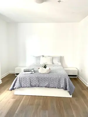 a white bedroom with a large bed and white walls at Private bedroom in Miami - Coral Gables 601 in Miami