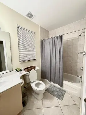 a bathroom with a toilet and a sink and a shower at Private bedroom in Miami - Coral Gables 601 in Miami