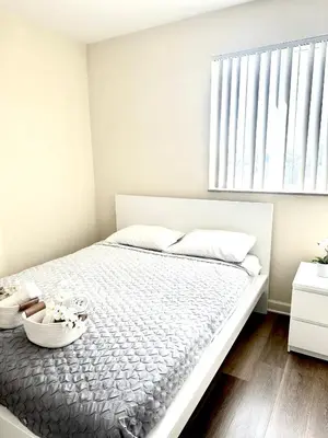 a white bedroom with a large bed with a window at Private bedroom in Miami - Coral Gables 601 in Miami