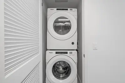 a washer and a washing machine in a room at New Luxury Apartment at Downtown Miami in Miami
