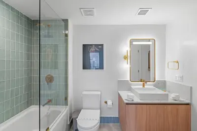 a bathroom with a toilet and a sink and a shower at New Luxury Apartment at Downtown Miami in Miami