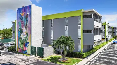 an apartment building with a mural on the side of it at Cordova Arms By Rocketstay in Fort Lauderdale