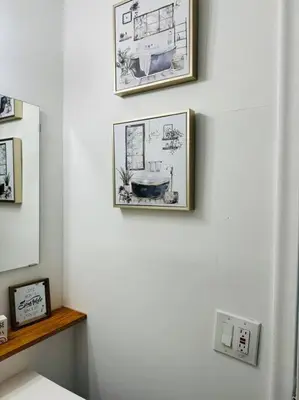 two pictures hanging on a wall in a room at Studio with Terrace Near Hard Rock-Patio in Fleetwood Manor