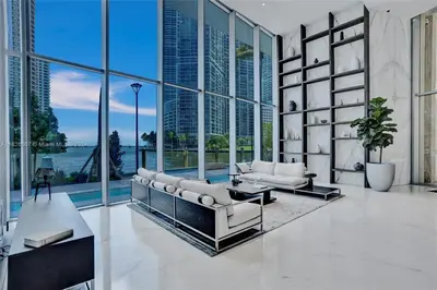 a living room with a couch and a table at ASTON MARTIN TOWER Miami in Miami