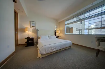 a bedroom with a large bed with a large window at Brickell High Floor AKA Free Parking by Palermo Home Miami in Miami