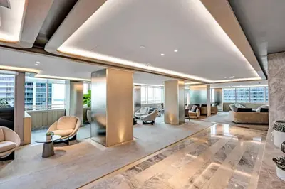 a lobby of a building with couches and chairs at Brickell High Floor AKA Free Parking by Palermo Home Miami in Miami
