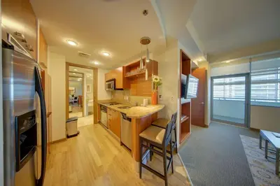 a kitchen with a refrigerator and a counter top at Brickell High Floor AKA Free Parking by Palermo Home Miami in Miami