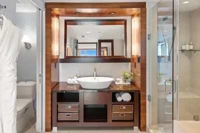 a bathroom with a sink and a mirror at 2 Bedroom Private Residence at Carillon Miami Resort -522 in Miami Beach