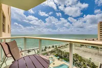 a balcony with a view of the ocean at Hollywood Condo with Beach Access - Walk to Shore! in Hollywood